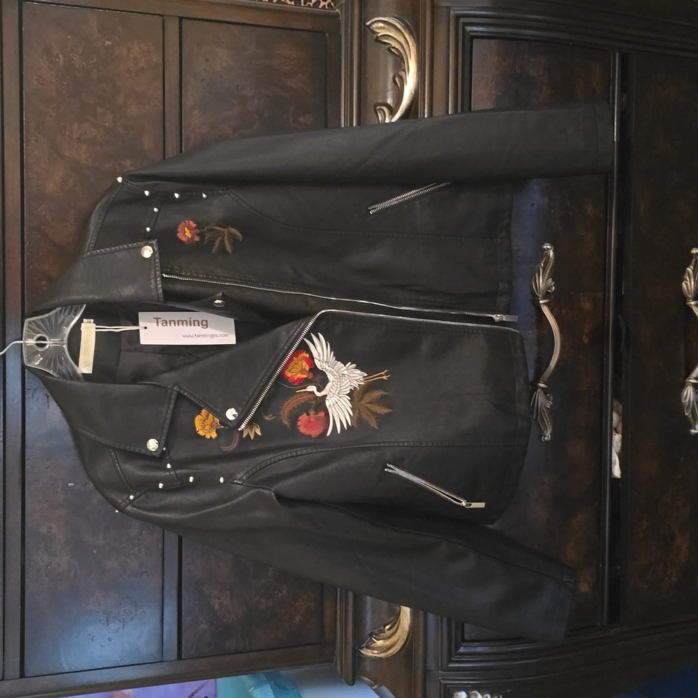 Embroidery faux leather jacket.